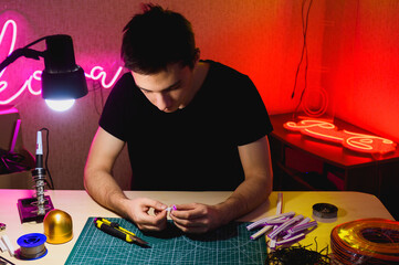 Craftsman folding flex neon near tools while doing signboard 