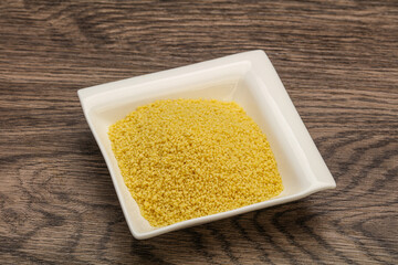 Raw cous cous heap in the bowl