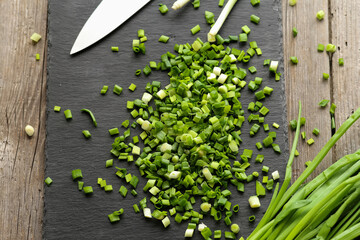 Green chopped onion on a board