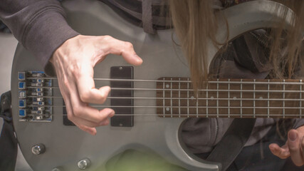 musician playing guitar, close up