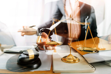 Business and lawyers discussing contract papers with brass scale on desk in office. Law, legal services, advice, justice and law concept picture with film grain effect