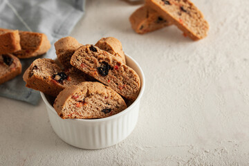 Italian cantuccini cookies with strawberries and raisins. Biscotti cookies with copy space for text.