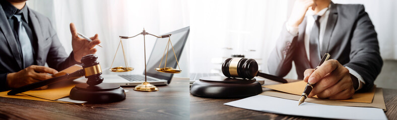 Business and lawyers discussing contract papers with brass scale on desk in office. Law, legal...