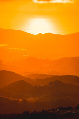 Gradient of colors in a beautiful sunset from a top of a mountain