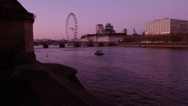 Twilight view of the river Thames, Westminster Bridge and London Eye in London, England, UK