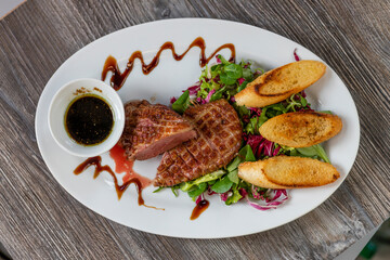 grilled duck breast with honey sauce and salad