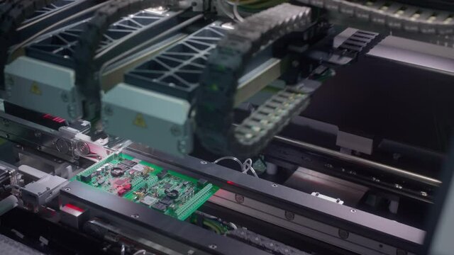 The fourth industrial revolution. Electronic circuit board production. Automated Circut Board machine Produces Printed digital electronic board. Electronics contract manufacturing. High-tech