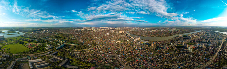 aerial panorama of the city of Krasnodar in the spring end of the day before sunset