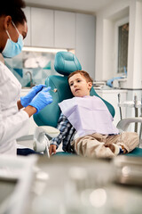 Cute little boy having dental appointment at dentist's office.