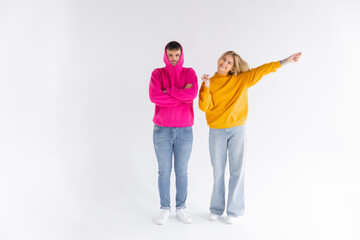 Portrait of cheerful people man and woman in basic clothing smiling and clenching fists like winners or happy people isolated over white background