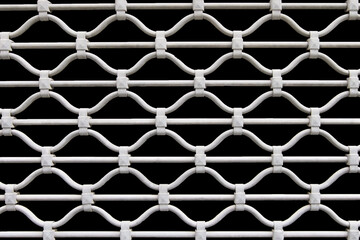 Openwork forged lattice isolated on a black background.