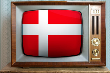 old tube vintage TV with the national flag of Denmark on the screen, the concept of eternal values ​​on television, global world trade, politics, retro technology