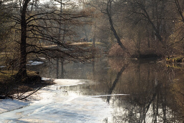 The ice has not yet melted in the park in the spring