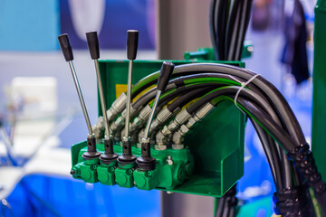Hydraulic manual control levers of agriculture machine equipment at farming exhibition, trade show...