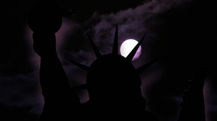 The statue of liberty of New York City against full  moon