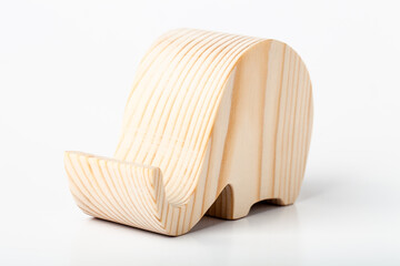 Elephant figurine carved from solid pine by hand jigsaw. On a white background