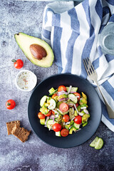 Cucumber tomato avocado red onion salad