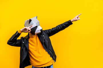 Man with funny low poly mask on colored background