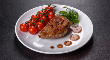 Baked duck breast with herbs and spices on a dark concrete background
