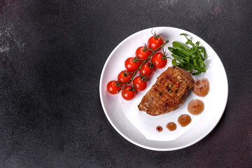 Baked duck breast with herbs and spices on a dark concrete background