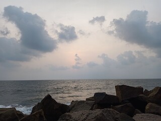 sea, sunset, beach, water, sky, ocean, landscape, clouds, coast, sun, rocks, nature, sunrise, blue, waves, seascape, rock, shore, evening, summer, cloud, horizon, coastline, stones, dawn