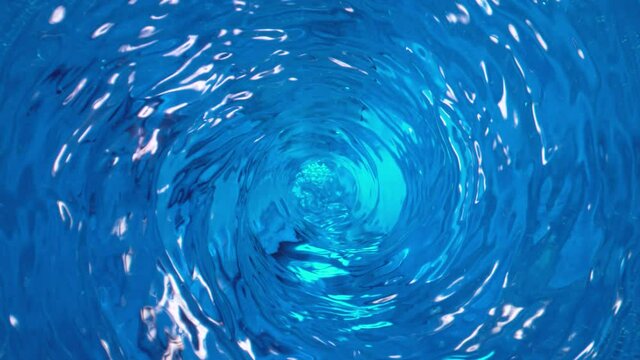 Super Slow Motion Shot of Water Whirl at 1000 fps. Camera Moving Outwards by Slider.