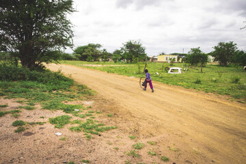 Boy pushing wheel