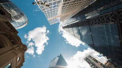 Bottom-up rotating timelapse of important and futuristic skyscrapers in the financial center of a major city - Powered by Adobe