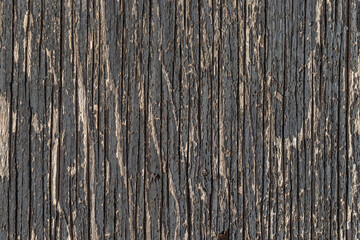 Old wooden abstract background texture surface with peeling black paint texture.