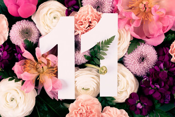 Layout with colorful flowers, leaves and number eleven. Chrysanthemum Momoko, Peony, Matthiola,...