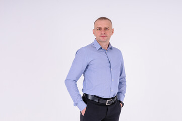 Man in blue shirt and black trousers on white background