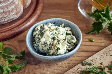 Herbal bread spread made from butter and young nettles collected in spring