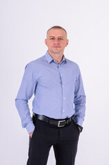 Fototapeta premium Man in blue shirt and black trousers on white background