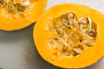 Pumpkin open in half with sprouted seeds