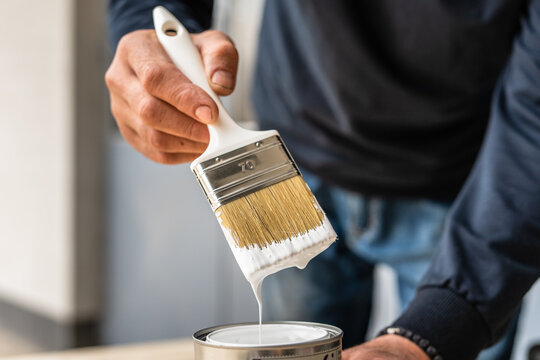 Close Up View Of A Hand Holding A Paintbrush High-Res Stock Photo