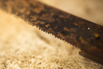 Rusty saw teeth close up, macro photo of an old unusable tool