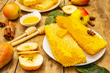 Autumn composition with fresh apples, pears, honeycombs and fragrant spices