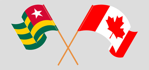 Crossed and waving flags of Togo and Canada