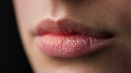 Macro of perfect natural female lips on black background. Plump sexy full lips.  © stockbusters