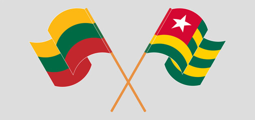 Crossed and waving flags of Lithuania and Togo