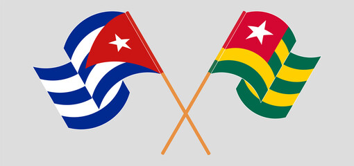 Crossed and waving flags of Cuba and Togo