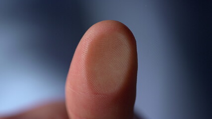 Marco video of fingerprint on glass surface indoors.Man thumbprint on windowpane