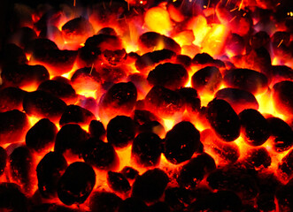 BBQ Grill Pit With Glowing And Flaming Hot Charcoal Briquettes, Food Background Or Texture, Close-Up, Top View