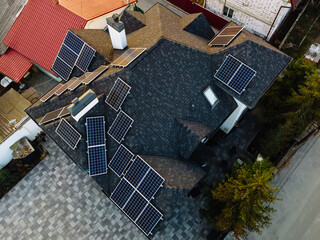 Aerial view of solar photovoltaic panels on a house roof