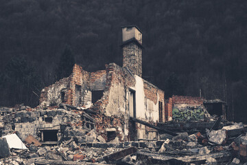 Ruins of the destroyed building in the mountains.