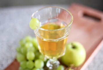 glass of white sweet wine vine grape apple fruits lime
