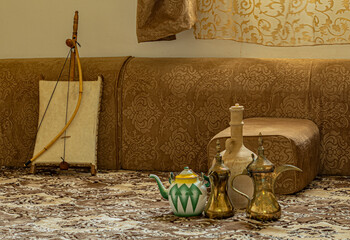 Teapots of coffee and tea with an old Arabic violin