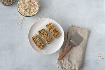 Home made gluten free granola bars shown with ingredients used in recipe.