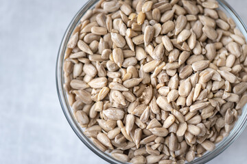 Macro view of a bowl of sunflower seeds.