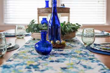 Closeup of spring table setting in blue and green palette